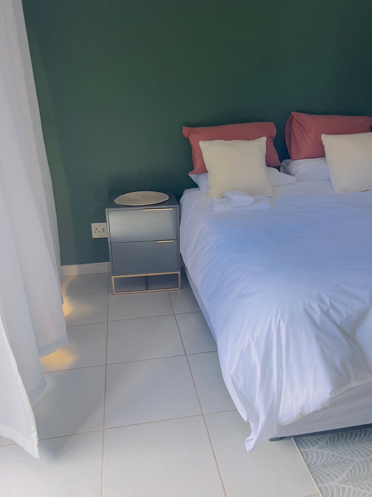 Elegant guest bedroom with bedside table