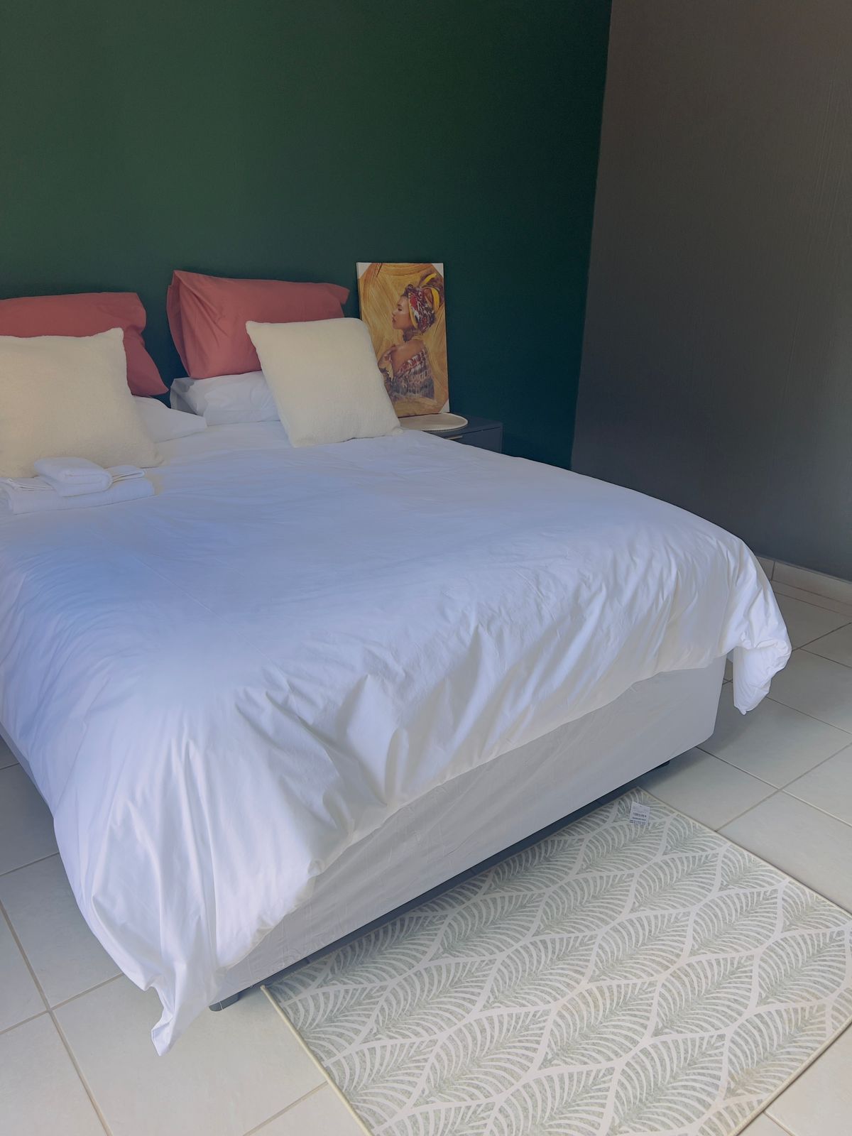 Bright guest room with feature wall