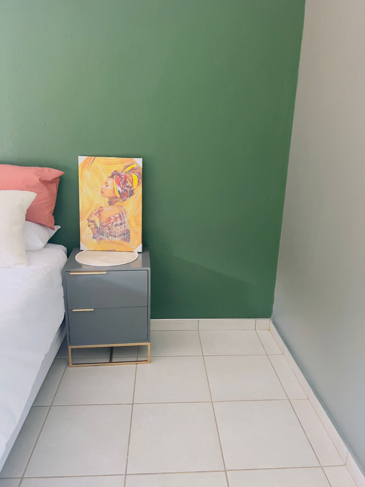 Cosy corner with artwork and bedside styling