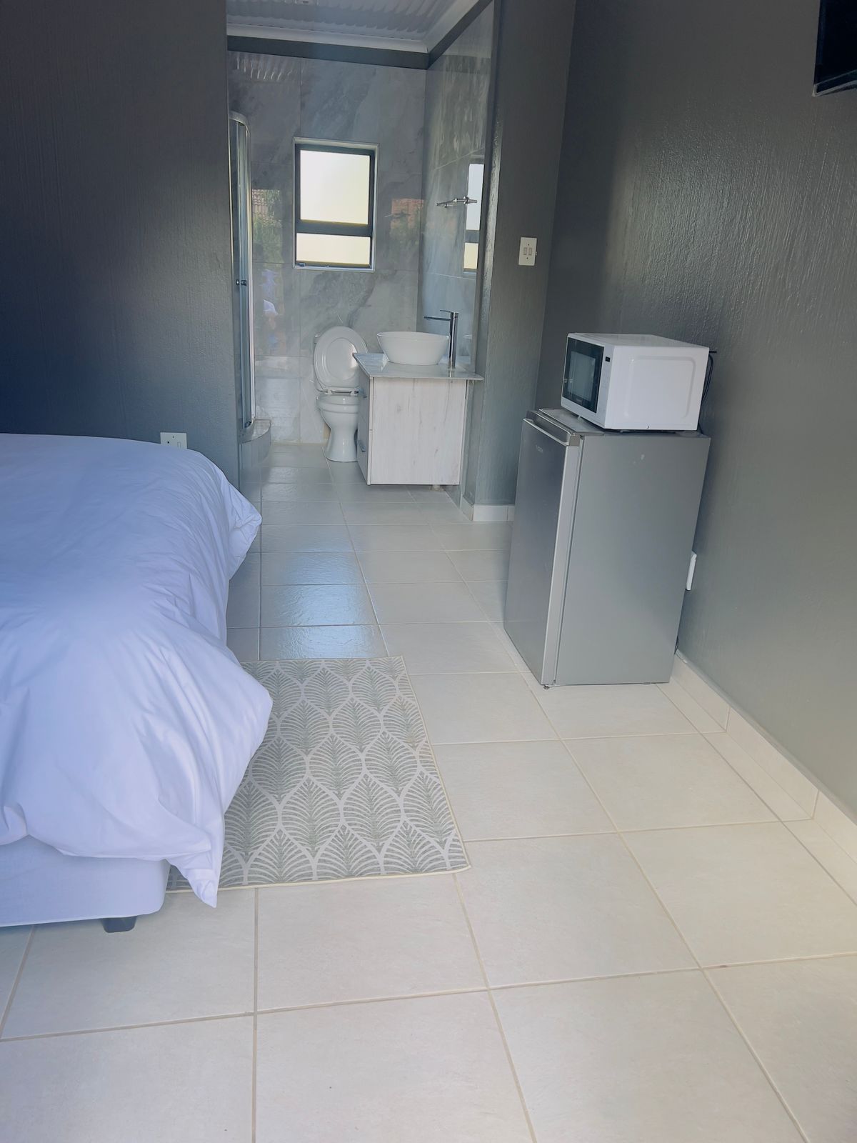 Open-plan room leading to private bathroom
